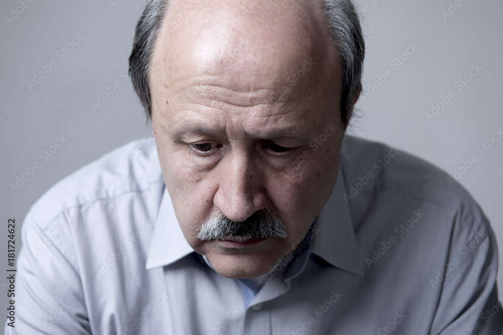 head portrait of senior mature old man on his 60s looking sad and worried suffering pain and depression in sadness face expression
