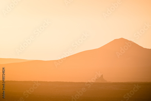 Lonely volcano in the national park of Timanfaya at sunset. Lanzarote. Canary Islands. Spain