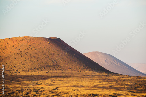 A stunning view of the volcanic landscape from the crater of the volcano El Cuervo. Lanzarote. Canary Islands. Spain