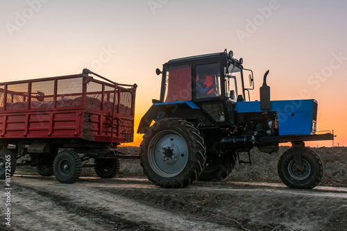 Farm tractor with a trailer
