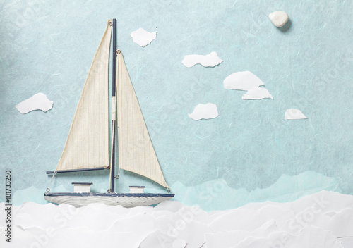 White wooden toy sailing boat
