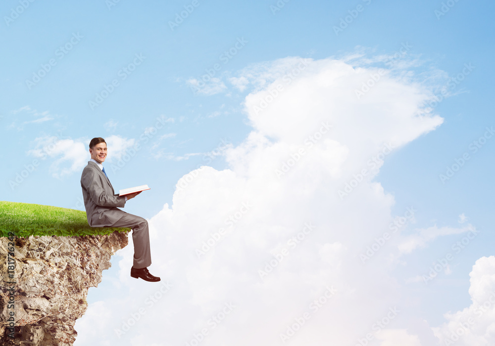 Student guy in suit with book in hands preparing for exam Student guy in suit with book in hands preparing for exam