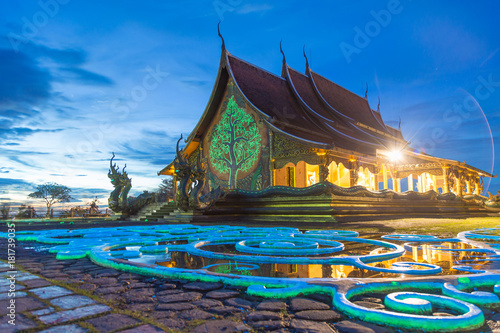 A beautiful color reflection with twilight at Wat Sirindhorn Wararam Phu Prao