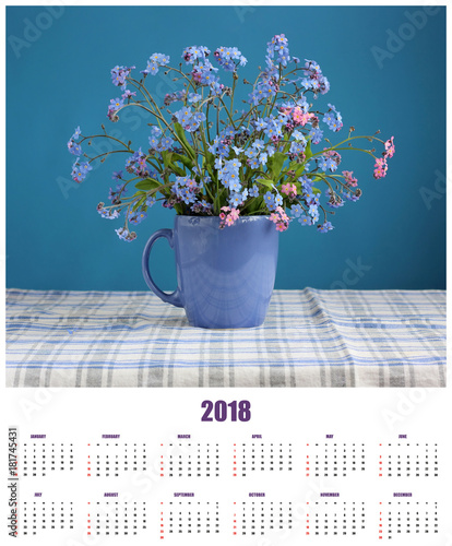 Wall calendar for 2018 with a bouquet of forget-me-nots.