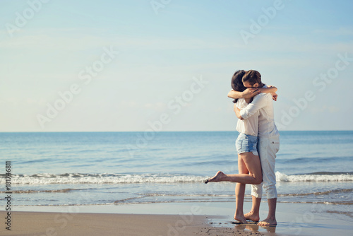Romantic young couple on the beach kissing. © FS-Stock