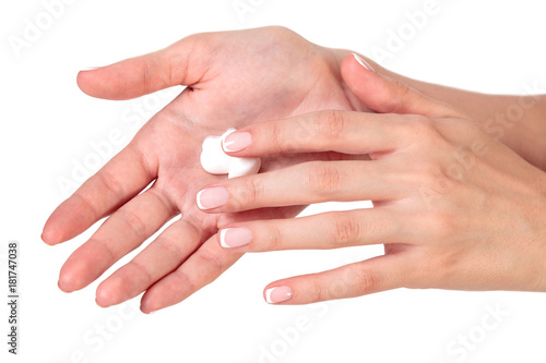 Closeup shot of beautiful woman's hands with cream, isolated on white background