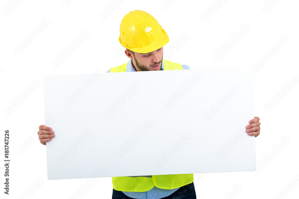 Happy male engineer holding an advertisement blank banner. Isolated on white background Happy male engineer holding an advertisement blank banner. Isolated on white background
