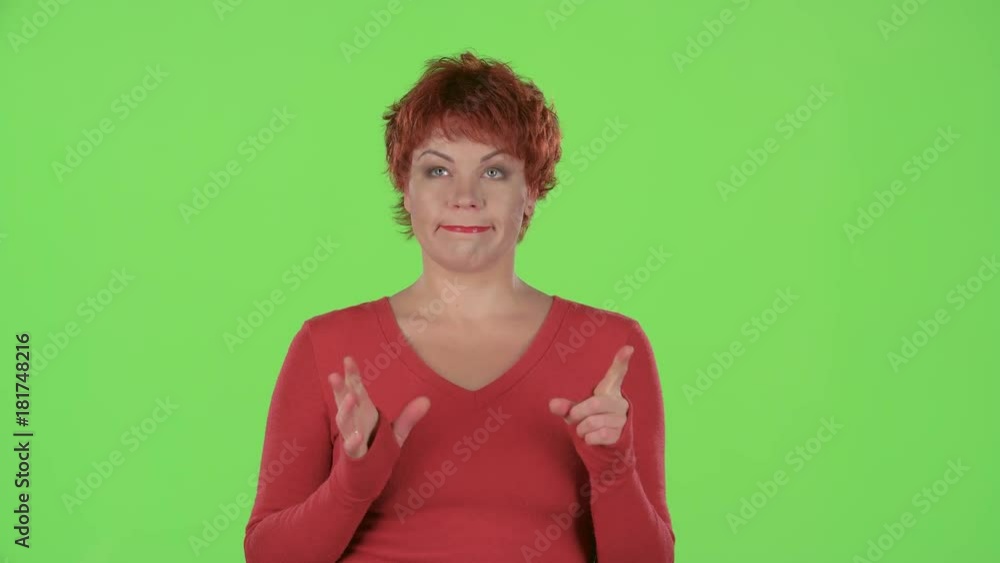 Redhaired woman makes a choice. Green screen Redhaired woman makes a choice. Green screen