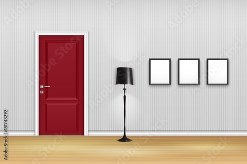 Living room interior with closed door, lamp, and empty frames on the wall