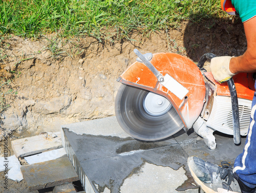 Worker with angle grinder photo