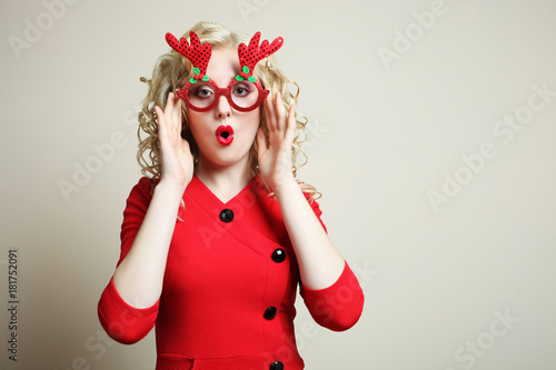 girl in red Christmas glasses