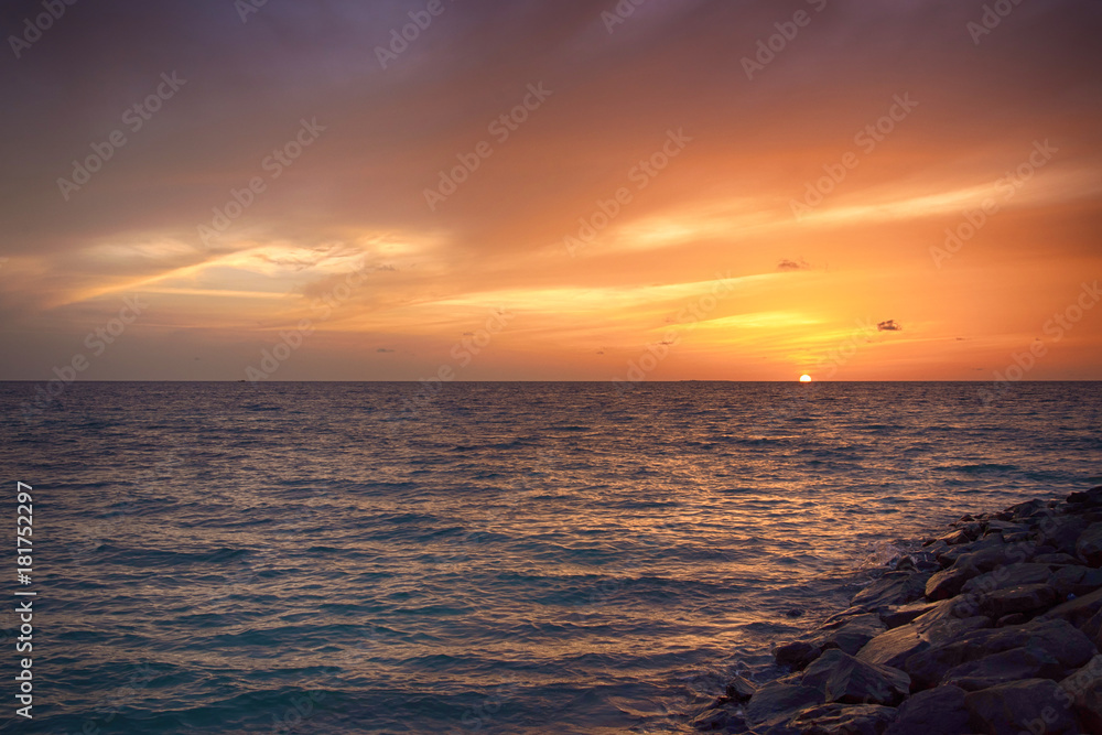 Sunset in the Maldives. Beautiful colorful sunset over the ocean at Maafushi island,Maldives