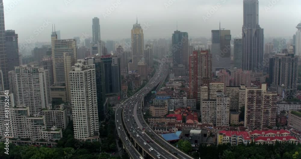 SHANGHAI, CHINA – JUNE 2016 : Aerial shot over Central Shanghai highway traffic during daytime SHANGHAI, CHINA – JUNE 2016 : Aerial shot over Central Shanghai highway traffic during daytime