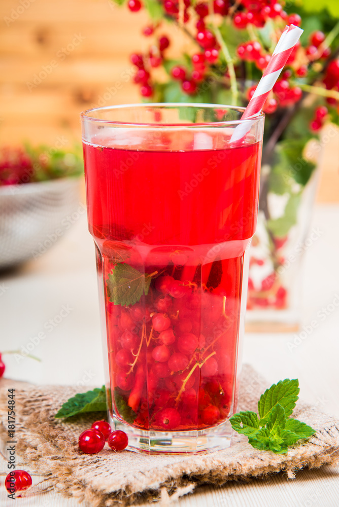 Morse from red currant (juice, compote) on a light background. Morse from red currant (juice, compote) on a light background.