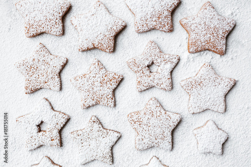 Christmas preparations star shaped gingerbread cookies with snowy sugar coating