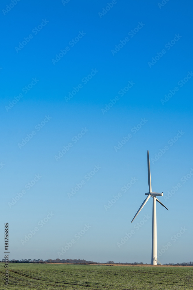 Single wind turbine on a clear blue sky day in the English countryside Single wind turbine on a clear blue sky day in the English countryside