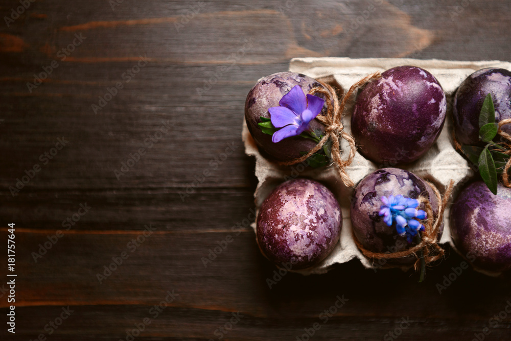 Expensive marble Easter eggs on a wooden background