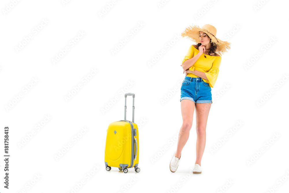 thoughtful woman looking at suitcase thoughtful woman looking at suitcase