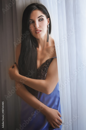 Fashion sexy brunette woman in boudoir lace dress. Portrait of sensual beautiful bride boho style. Beauty lady with long hair and bridal makeup. Vintage lady.