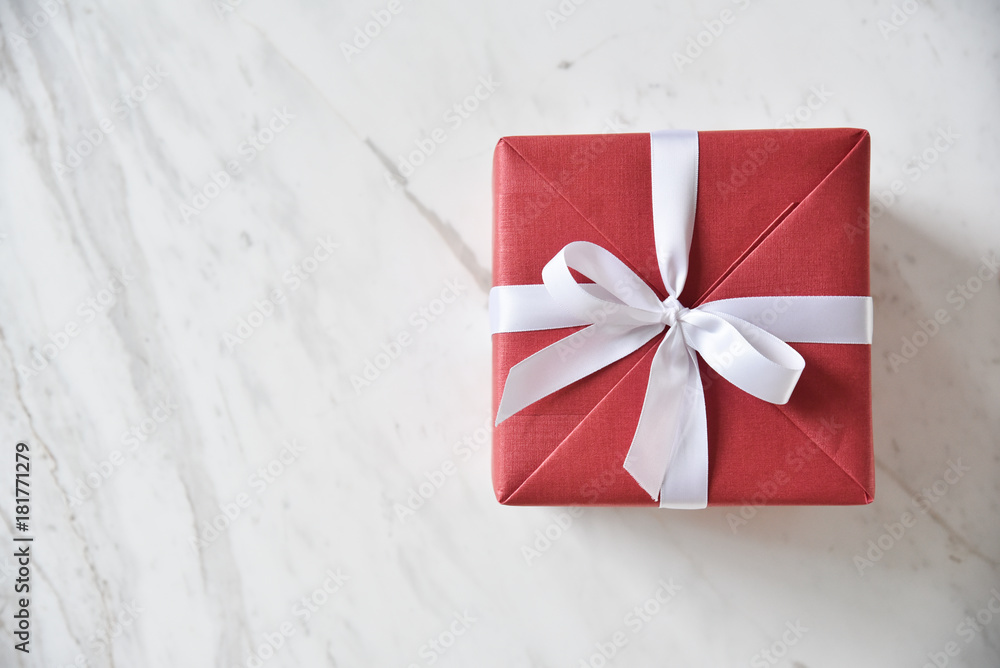 Top view of red gift box with white ribbon. Top view of red gift box with white ribbon.