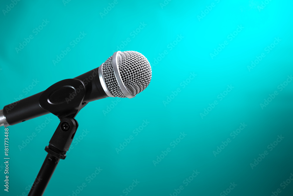 Microphone with turquoise wall background Microphone with turquoise wall background