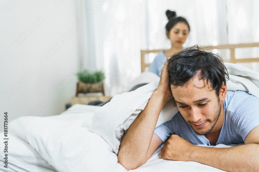Couple have sex problems on the couch. Lovers unhappy in life partner. Concept of lifestyle and family. Couple have sex problems on the couch. Lovers unhappy in life partner. Concept of lifestyle and family.