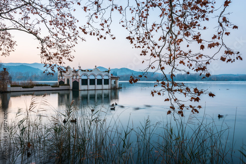 Typical building in the lake of Banyoles during a sunset photo