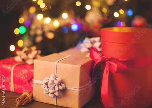 Christmas box gifts in focus under the Christmas tree