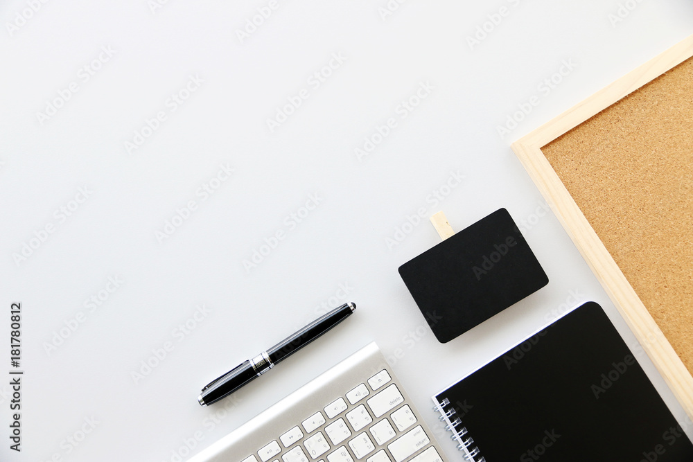 Top view tablet,Notebook,Pen and keyboard on office desk.Top view with copy space. Top view tablet,Notebook,Pen and keyboard on office desk.Top view with copy space.