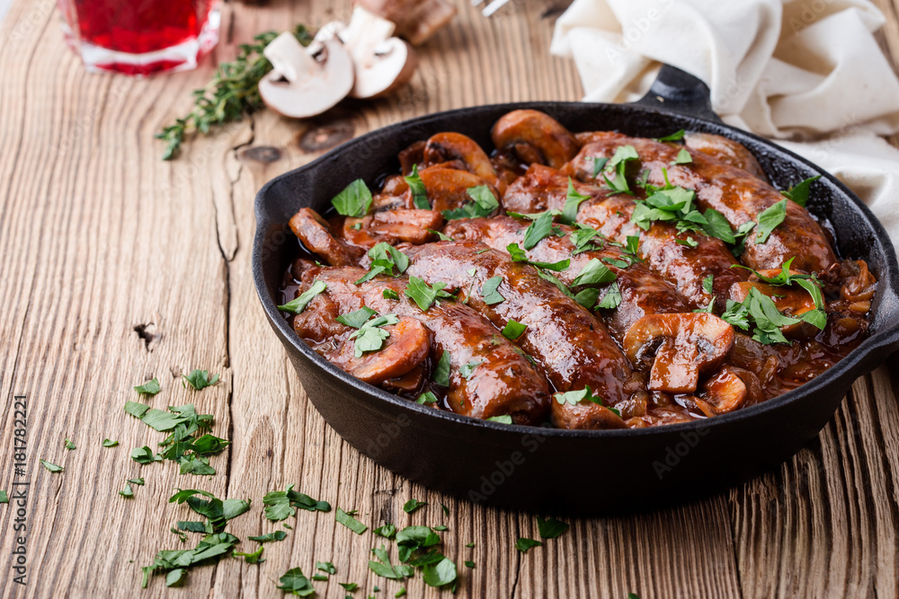 Sausages with onion and mushrooms gravy Sausages with onion and mushrooms gravy