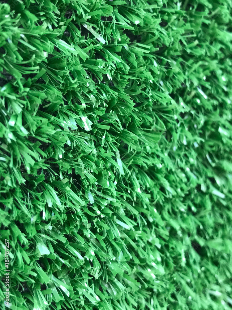 Side view of artificial green turf background Side view of artificial green turf background
