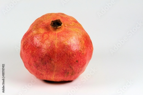 Pomegranate fruit on white background.