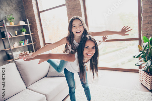 Fotografie We are playing together! Cute playful joyful funny little girl is showing a plan