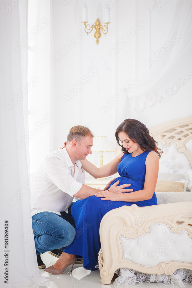 pregnant woman and a man hugging with love pregnant woman and a man hugging with love