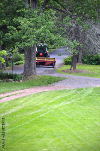 Farm Tractor Pulling Hay Disc On Country Road