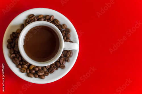 white coffee mug on a red background. top view. copy space.