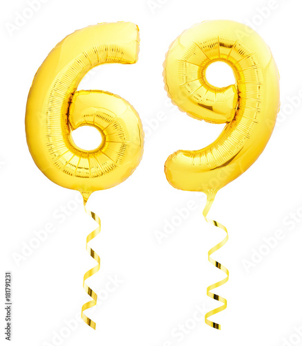 Golden number sixty nine 69 made of inflatable balloon with ribbon on white photo