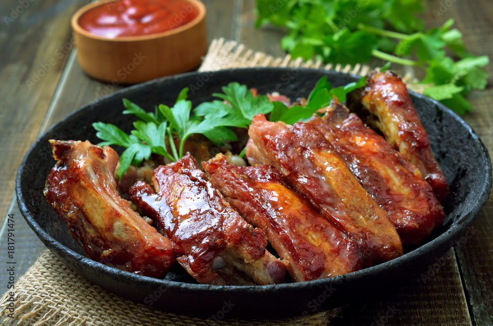 Fototapeta premium Appetizer roast sliced pork ribs