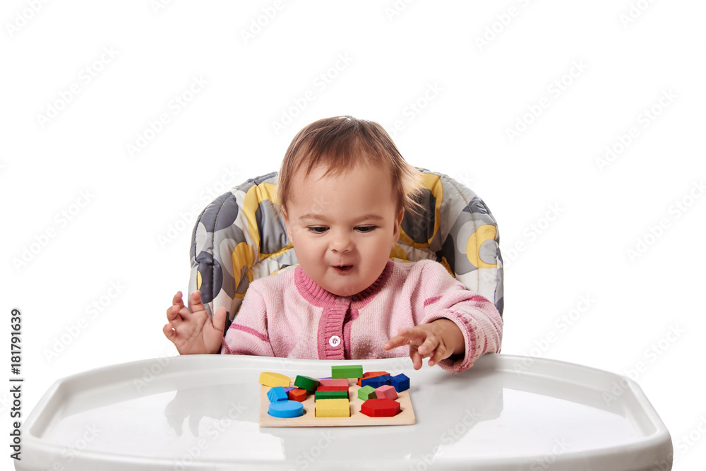 Child little girl learning to use colorful logic game isolated on white background Child little girl learning to use colorful logic game isolated on white background