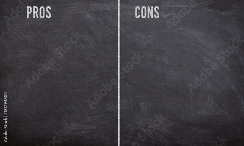 pros and cons chalk written text on a black board