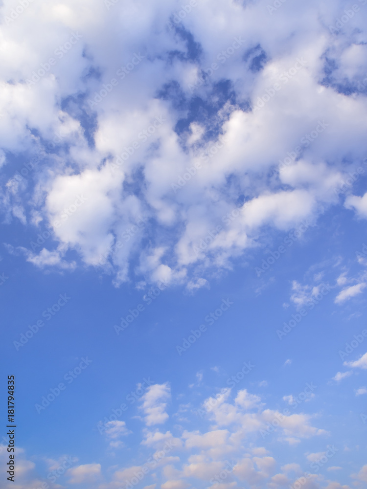 Fluffy clouds in the blue sky with morning light from the sunrise Fluffy clouds in the blue sky with morning light from the sunrise