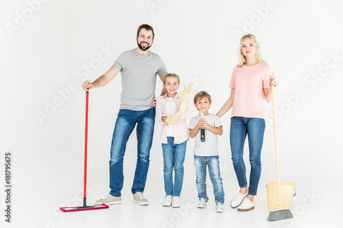 family with cleaning equipment