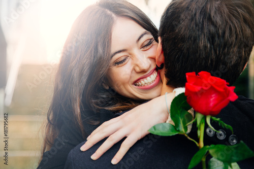 Happy couple in love with a rose