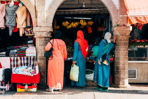 moroccan womans shopping at market, marrakech © jon_chica