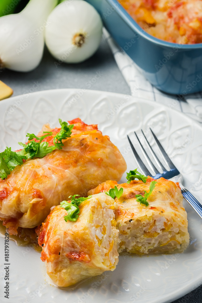 Stuffed cabbage in a baking dish with ingredients. Selective focus, close up. Stuffed cabbage in a baking dish with ingredients. Selective focus, close up.