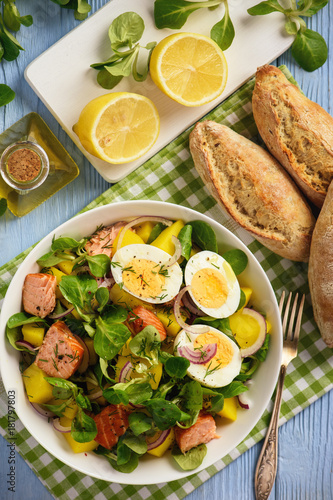 Healthy salad with salmon, potatoes, eggs and lamb's lettuce.