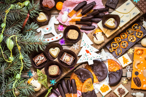 Chocolate candy, citrus fruit, dessert, oranges with Christmas symbols
