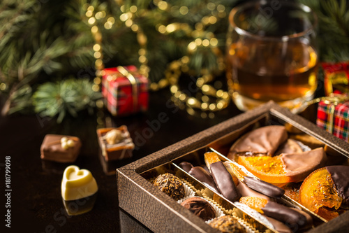 Chocolate candy, citrus fruit, dessert, oranges with Christmas symbols © Наталья Майорова