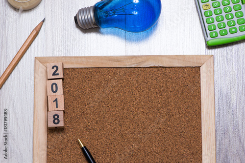 The cork board with official tools and 2018 new years cubes for add text