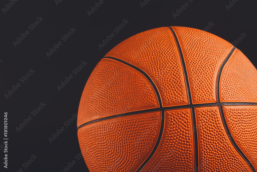 Fototapeta premium Basketball ball on black background copy space
